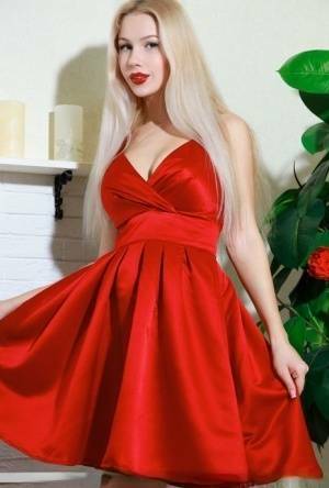 Nice blonde teen Genevieve Gandi removes red dress to display her trimmed muff on myfans.pics