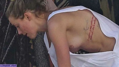 Amber Heard caught topless on the beach on myfans.pics