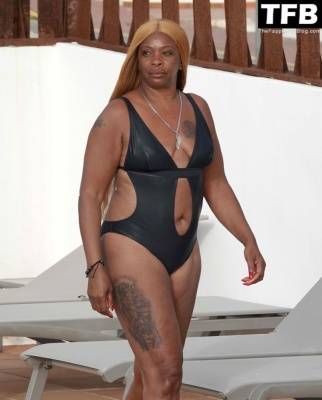 Sandi Bogle Shows Off Her Voluptuous Figure in a Swimsuit Poolside Out in Ibiza on myfans.pics