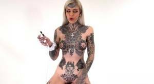 Tattoo enthusiast Amber Luke rides a multispeed sex machine on myfans.pics