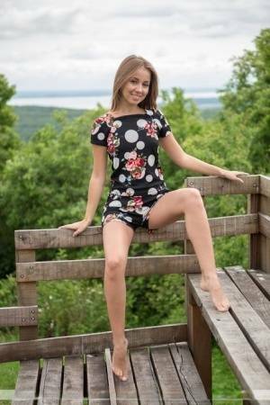 Barefoot teen Linda A gets totally naked at a lookout spot in the woods on myfans.pics