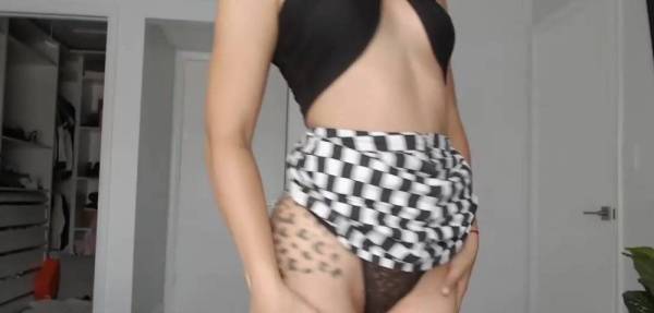Beautiful curly bitch Xoleelee in a skirt posing for the camera on myfans.pics